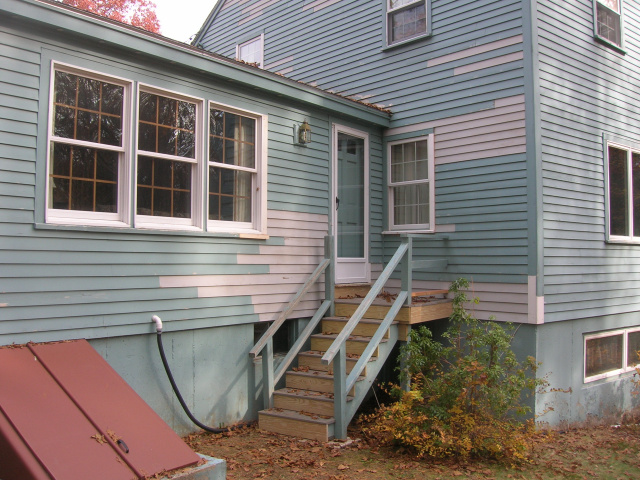 rebuilt back stairway and replaced rotted wood